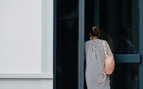 Cats reacting to unfamiliar guests entering quickly